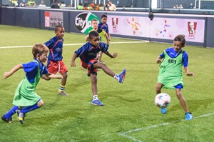Children playing a match on a get-together day