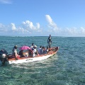 Agalega, children going to school by boat